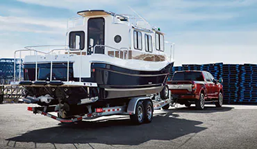 2022 Nissan TITAN Truck towing boat | Benton Nissan Bessemer in Bessemer AL